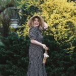 Woman wearing a stylish polka dot dress